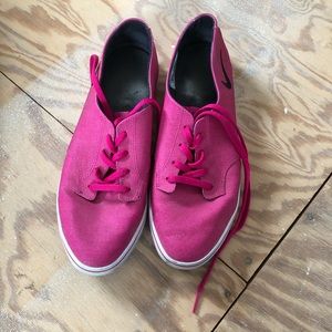 Pink Nike flats